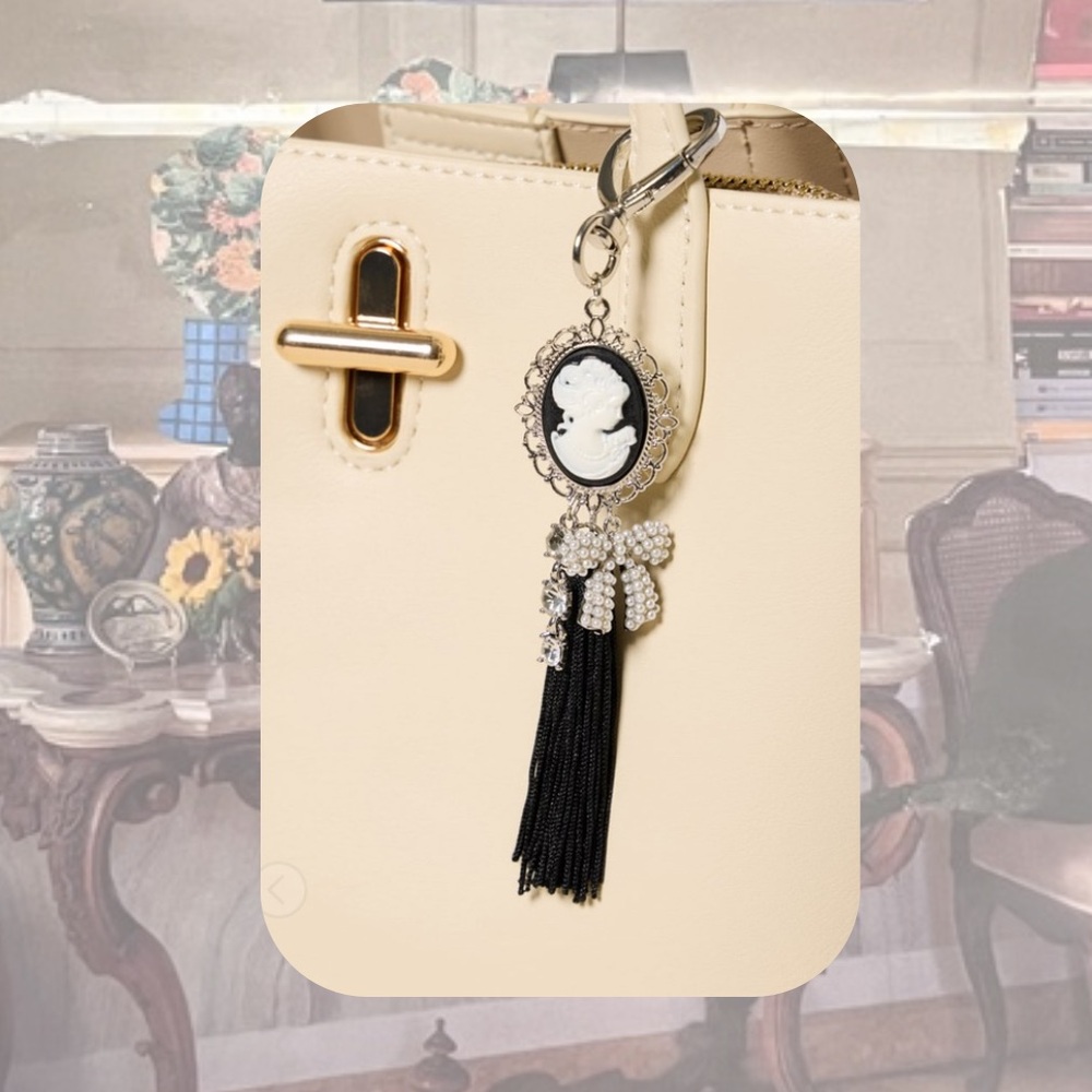 🎉 Francesca’s Black & White Victorian Cameo Black Tassel Bag Charm